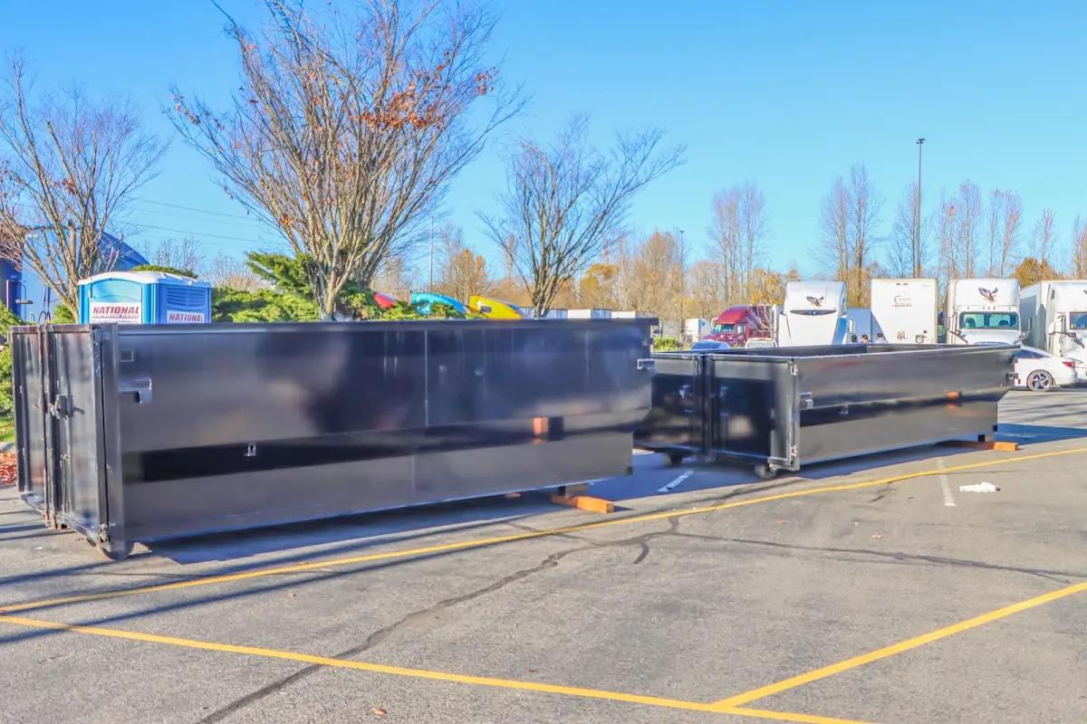 Professional dumpster rental service with roll-off container on residential driveway in Diamond Bar